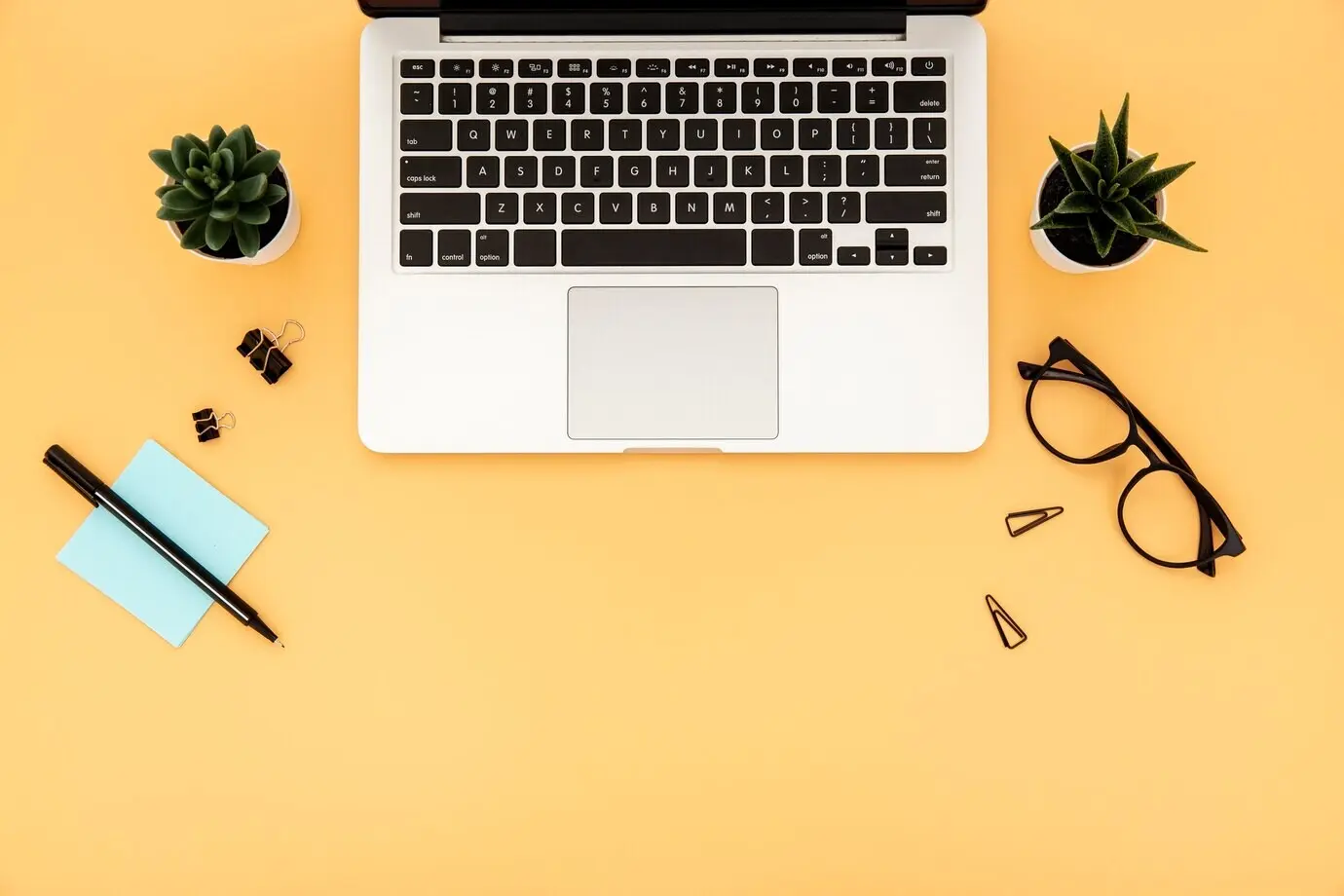 An orderly arrangement of desk items with copy space